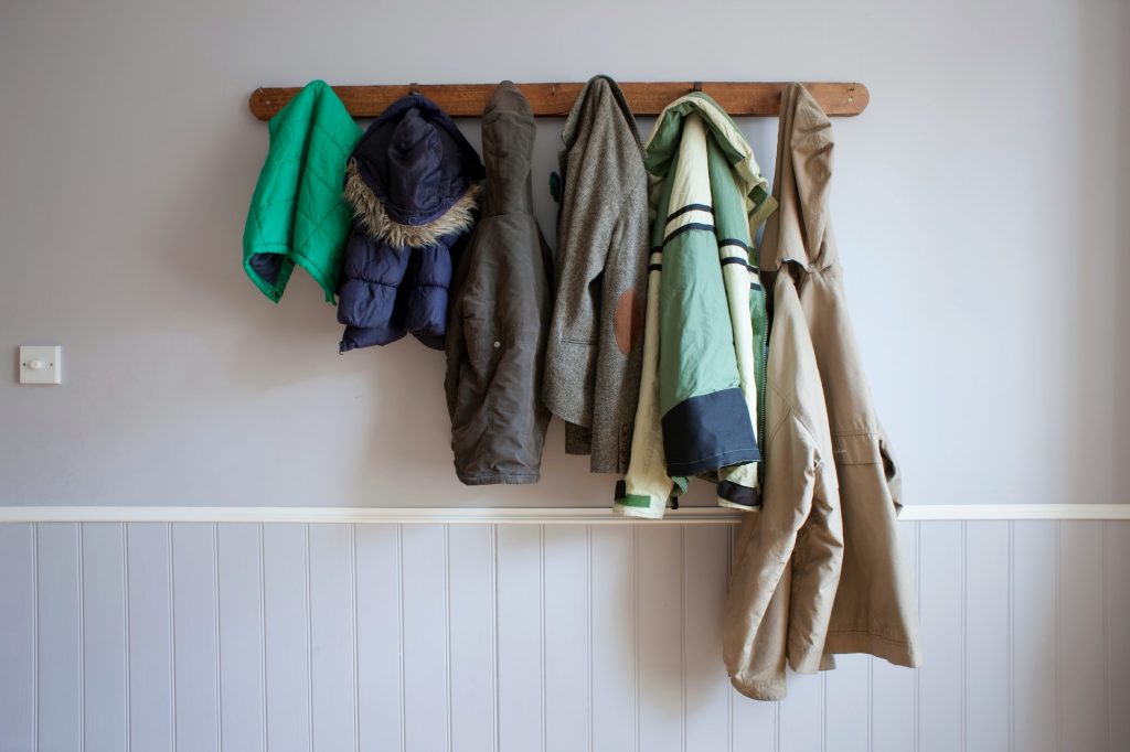 Coats hanging on coat rack